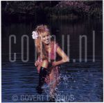 24-06-2001 Patricia Paay at home in Rijkevorsel, Belgium. By order of Beaumonde Magazine. May 24, 2001.

[keywords]Posed, Laughing, Water[/keywords]